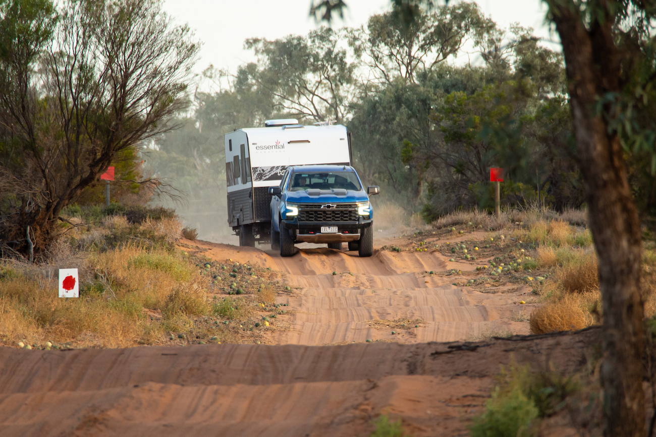 The Essential Caravan Highlander single-axle caravan tackling an off-road track